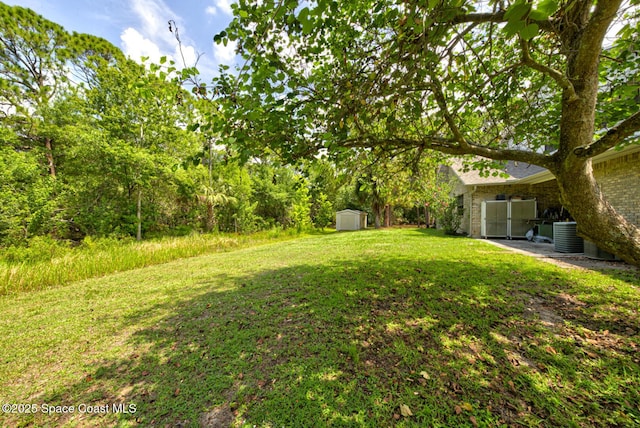 4956 Corfu Dr, Cocoa, FL 32926 - view of green lawn featuring central AC