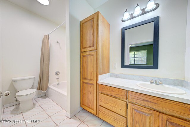 4956 Corfu Dr, Cocoa, FL 32926 - full bathroom with toilet, vanity, shower / tub combo with curtain, tile patterned floors, and baseboards