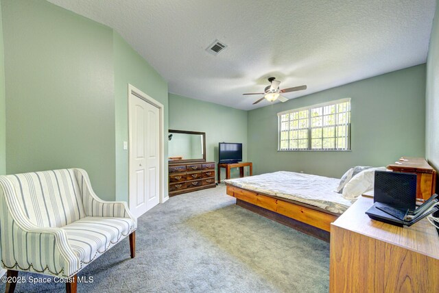 4956 Corfu Dr, Cocoa, FL 32926 - carpeted bedroom featuring a ceiling fan and a textured ceiling