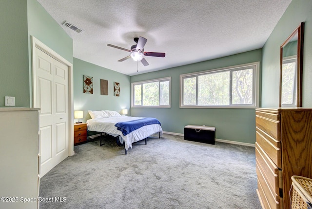 4956 Corfu Dr, Cocoa, FL 32926 - bedroom featuring carpet floors, a textured ceiling, ceiling fan, and baseboards