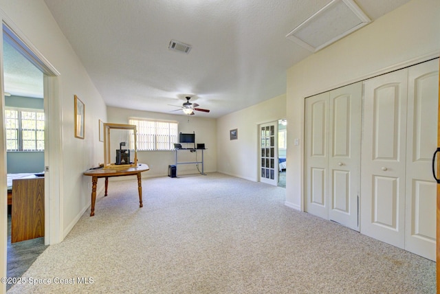 4956 Corfu Dr, Cocoa, FL 32926 - unfurnished living room featuring carpet flooring, attic access, ceiling fan, and baseboards