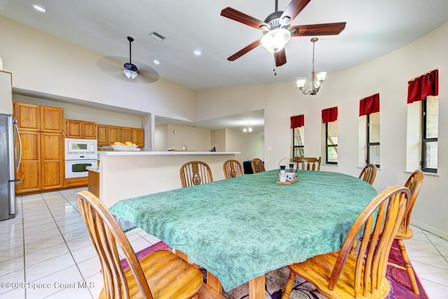 4956 Corfu Dr, Cocoa, FL 32926 - dining area featuring a ceiling fan, light tile patterned floors, recessed lighting, baseboards, and a chandelier