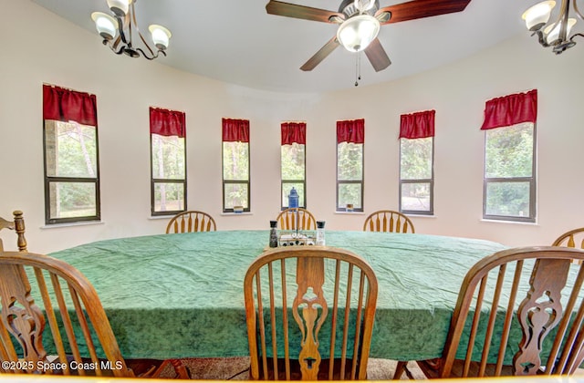 4956 Corfu Dr, Cocoa, FL 32926 - dining area featuring a chandelier, healthy amount of natural light, and a ceiling fan
