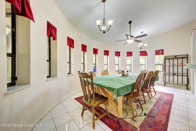 4956 Corfu Dr, Cocoa, FL 32926 - dining space featuring a chandelier, light tile patterned flooring, a ceiling fan, and baseboards