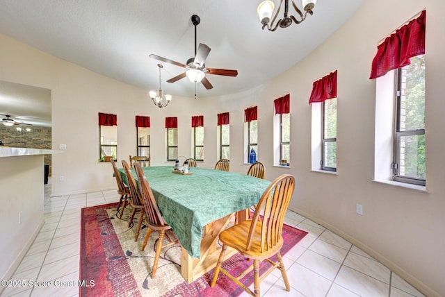 4956 Corfu Dr, Cocoa, FL 32926 - dining space with a chandelier, light tile patterned floors, ceiling fan, and baseboards