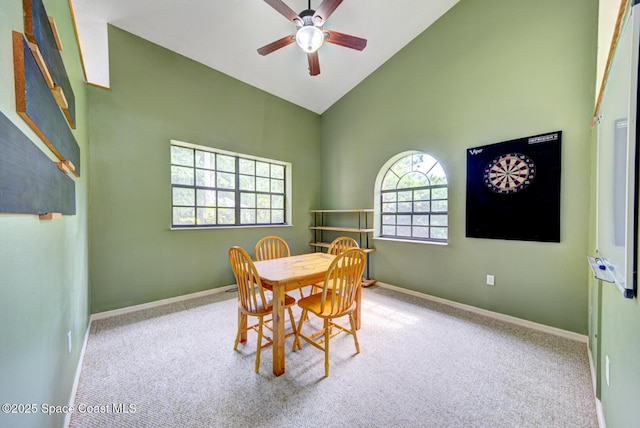 4956 Corfu Dr, Cocoa, FL 32926 - carpeted dining room featuring high vaulted ceiling, ceiling fan, and baseboards