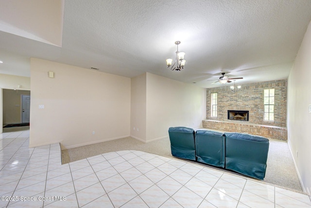4956 Corfu Dr, Cocoa, FL 32926 - unfurnished living room with a fireplace, light colored carpet, a chandelier, ceiling fan, and a textured ceiling