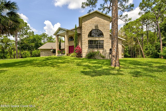 4956 Corfu Dr, Cocoa, FL 32926 - view of front of house with a front lawn and brick siding