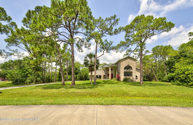 4956 Corfu Dr, Cocoa, FL 32926 - view of front facade featuring a front yard