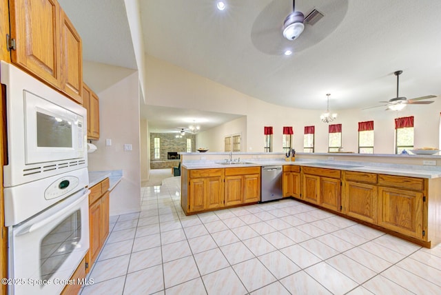 4956 Corfu Dr, Cocoa, FL 32926 - kitchen featuring ceiling fan, white appliances, open floor plan, lofted ceiling, and a sink