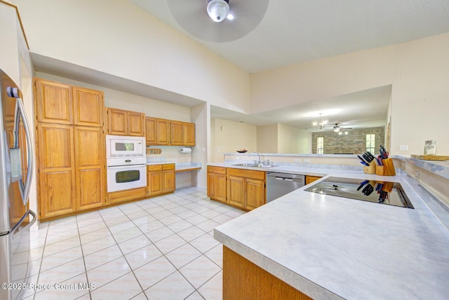 4956 Corfu Dr, Cocoa, FL 32926 - kitchen featuring stainless steel appliances, ceiling fan, a sink, and light countertops