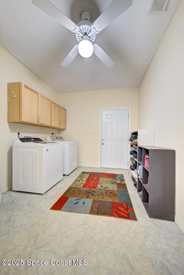 4956 Corfu Dr, Cocoa, FL 32926 - washroom featuring cabinet space, washing machine and clothes dryer, baseboards, a ceiling fan, and light floors