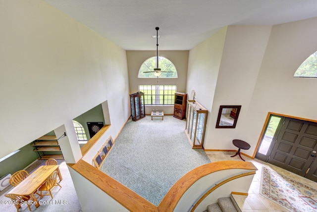 4956 Corfu Dr, Cocoa, FL 32926 - carpeted foyer with a high ceiling and baseboards