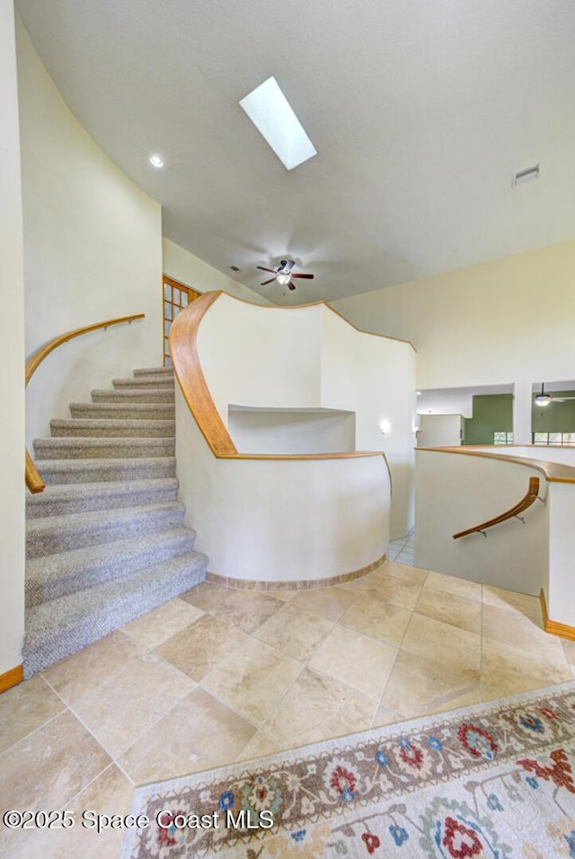 4956 Corfu Dr, Cocoa, FL 32926 - bathroom with a skylight, a ceiling fan, and baseboards