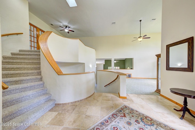 4956 Corfu Dr, Cocoa, FL 32926 - stairs featuring a ceiling fan, baseboards, and tile patterned floors