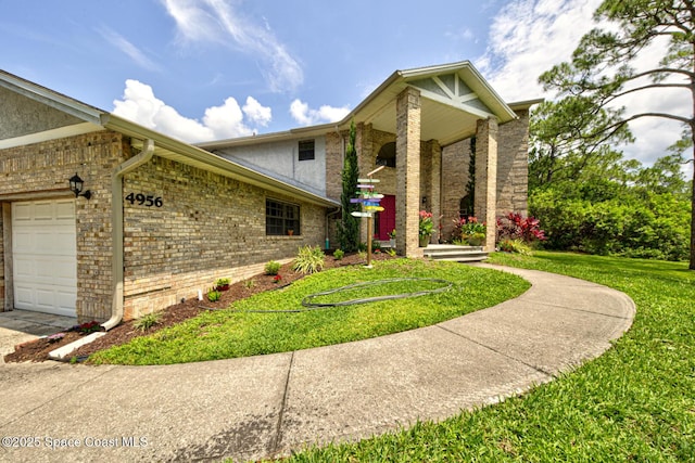 4956 Corfu Dr, Cocoa, FL 32926 - view of front facade featuring a front lawn, brick siding, and an attached garage