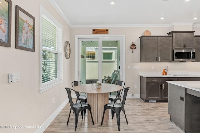 786 Clearwater Ave, Satellite Beach, FL 32937 - dining area featuring crown molding, light wood-style floors, and recessed lighting