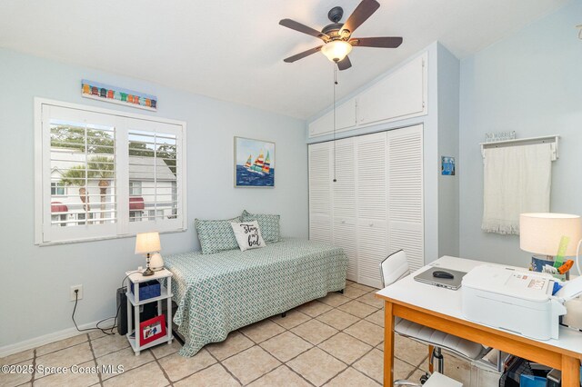 403 Seaport Blvd Unit T145, Cape Canaveral, FL 32920 - bedroom with vaulted ceiling, a closet, light tile patterned floors, an office area, and a ceiling fan