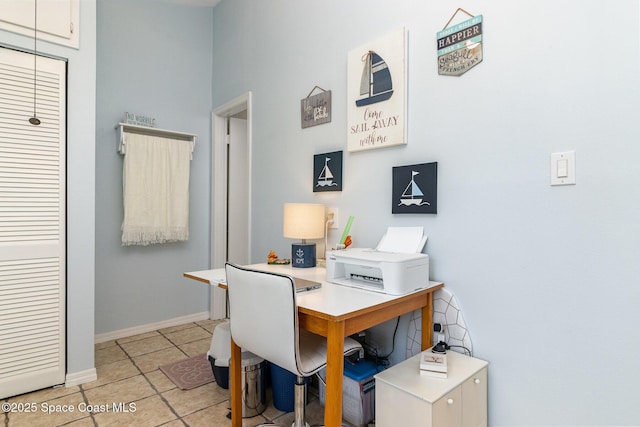 403 Seaport Blvd Unit T145, Cape Canaveral, FL 32920 - office area with light tile patterned floors and baseboards