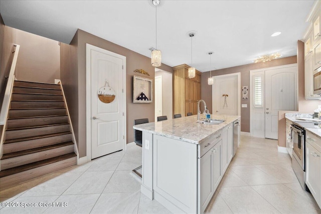 1039 Steven Patrick Ave, Indian Harbour Beach, FL 32937 - kitchen featuring a sink, stainless steel appliances, baseboards, and light tile patterned floors