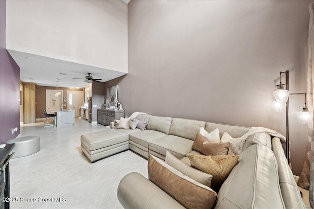 1039 Steven Patrick Ave, Indian Harbour Beach, FL 32937 - living area with a ceiling fan and a high ceiling