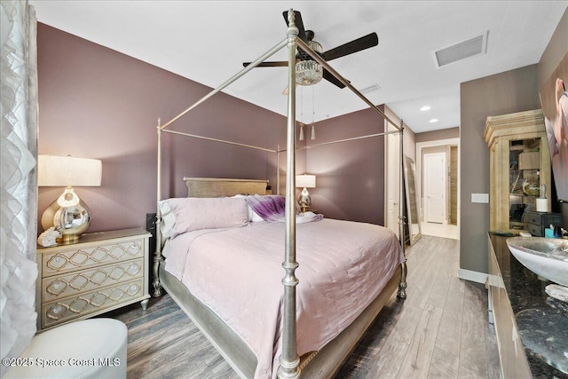 1039 Steven Patrick Ave, Indian Harbour Beach, FL 32937 - bedroom featuring wood finished floors, baseboards, a ceiling fan, and recessed lighting