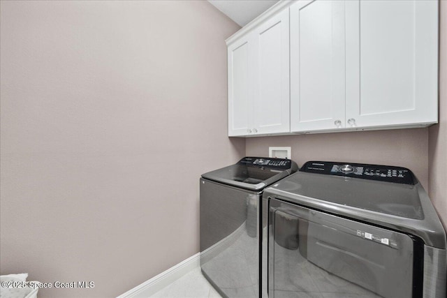 1039 Steven Patrick Ave, Indian Harbour Beach, FL 32937 - laundry room featuring cabinet space, washing machine and clothes dryer, and baseboards