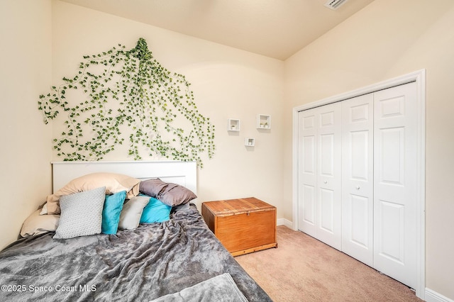4725 Papaya St, Cocoa, FL 32926 - bedroom with carpet floors, a closet, lofted ceiling, and baseboards