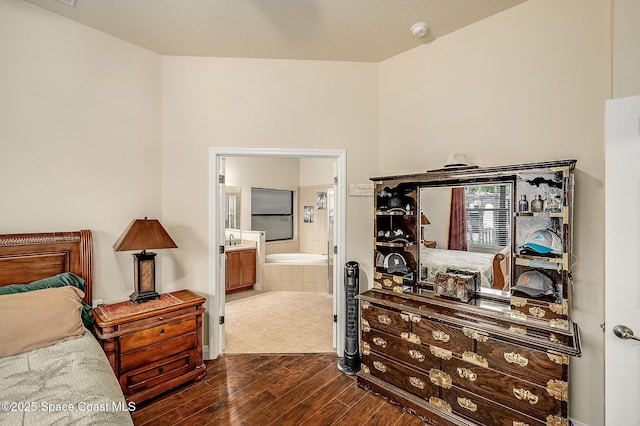 4725 Papaya St, Cocoa, FL 32926 - bedroom with dark wood-style floors and connected bathroom