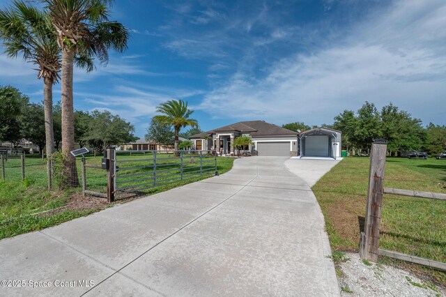 4725 Papaya St, Cocoa, FL 32926 - ranch-style house with a detached garage and concrete driveway
