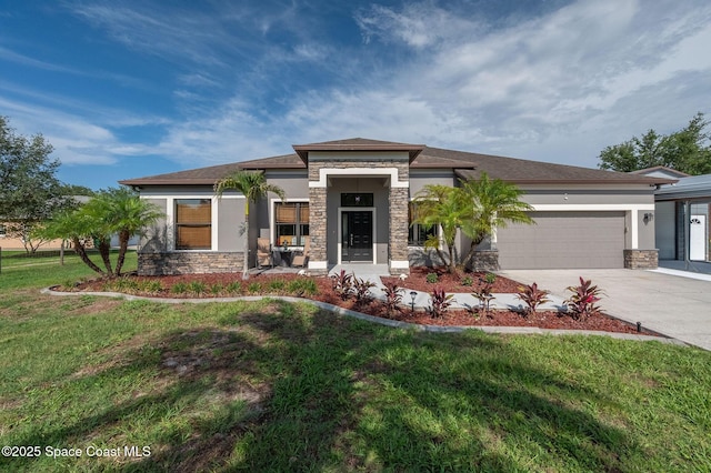 4725 Papaya St, Cocoa, FL 32926 - prairie-style home featuring stone siding, an attached garage, concrete driveway, a front lawn, and stucco siding