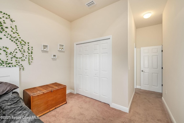 4725 Papaya St, Cocoa, FL 32926 - bedroom with light colored carpet, baseboards, and a closet