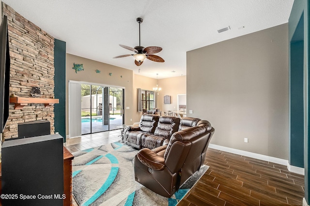 4725 Papaya St, Cocoa, FL 32926 - living area featuring ceiling fan, baseboards, wood finished floors, and a chandelier