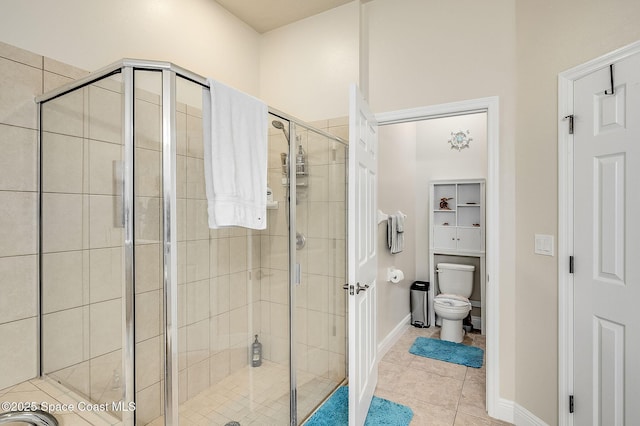 4725 Papaya St, Cocoa, FL 32926 - full bathroom featuring a stall shower, toilet, tile patterned flooring, and baseboards