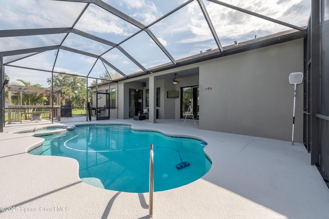 4725 Papaya St, Cocoa, FL 32926 - view of swimming pool with a patio area, ceiling fan, a pool with connected hot tub, and glass enclosure