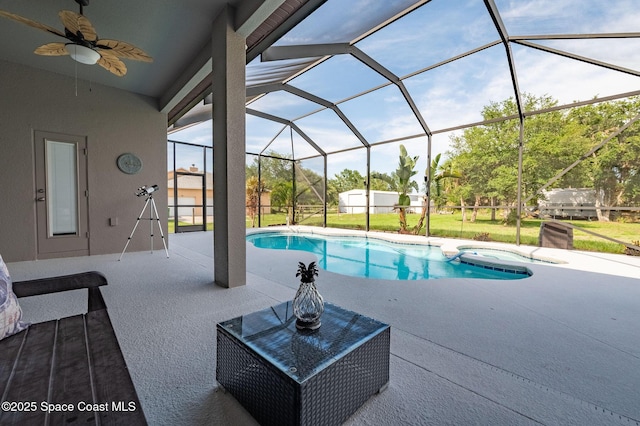 4725 Papaya St, Cocoa, FL 32926 - view of pool featuring a patio area, a ceiling fan, glass enclosure, and a storage shed