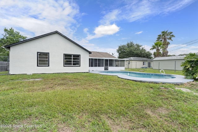 822 Lamplighter Dr NW, Palm Bay, FL 32907 - rear view of property with a sunroom and stucco siding