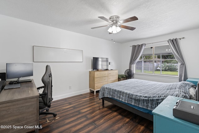 822 Lamplighter Dr NW, Palm Bay, FL 32907 - bedroom featuring wood finished floors, a textured ceiling, an office area, baseboards, and a ceiling fan