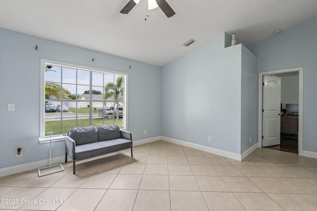 822 Lamplighter Dr NW, Palm Bay, FL 32907 - sitting room with a ceiling fan, plenty of natural light, vaulted ceiling, and baseboards