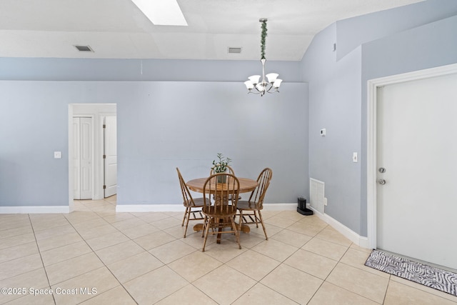 822 Lamplighter Dr NW, Palm Bay, FL 32907 - dining area with light tile patterned floors, a chandelier, a skylight, vaulted ceiling, and baseboards