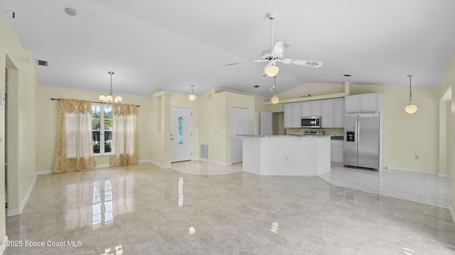 525 Banana Blvd, Merritt Island, FL 32952 - kitchen with appliances with stainless steel finishes, white cabinetry, a center island, lofted ceiling, and a chandelier