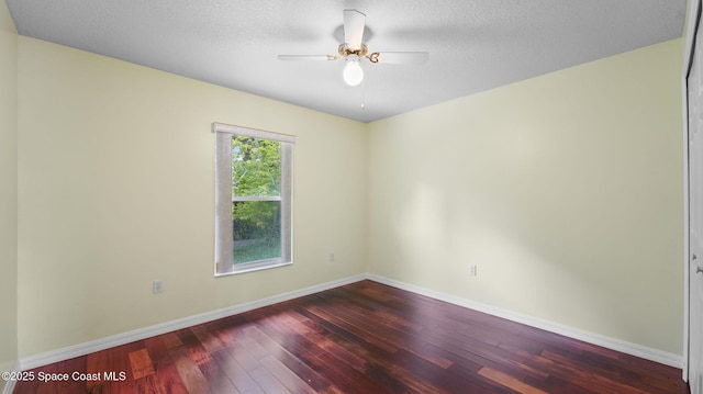 525 Banana Blvd, Merritt Island, FL 32952 - unfurnished room featuring hardwood / wood-style floors, a ceiling fan, and baseboards
