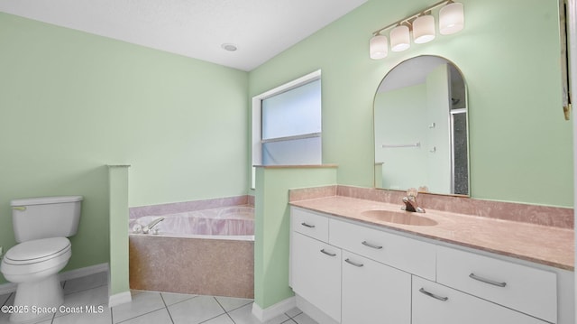 525 Banana Blvd, Merritt Island, FL 32952 - full bathroom featuring a bath, vanity, toilet, tile patterned flooring, and baseboards