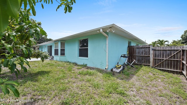525 Banana Blvd, Merritt Island, FL 32952 - view of side of home with stucco siding