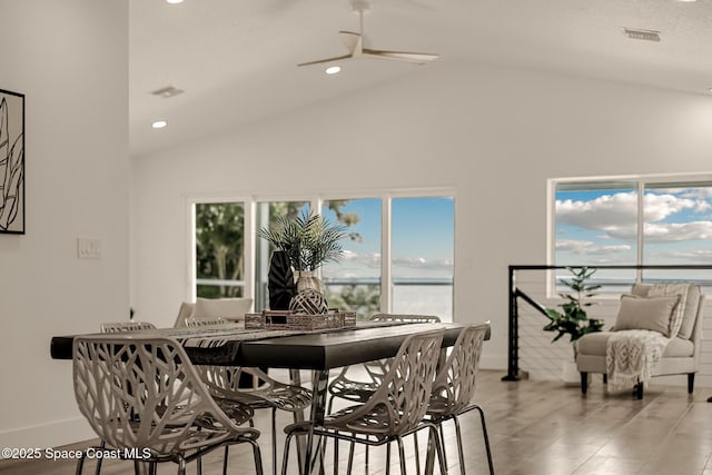 1313 Worth Ct NE, Palm Bay, FL 32905 - dining space featuring ceiling fan, baseboards, recessed lighting, high vaulted ceiling, and a water view