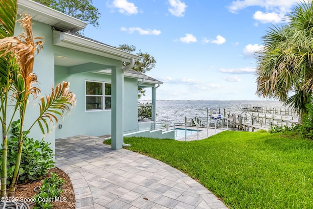 1313 Worth Ct NE, Palm Bay, FL 32905 - view of patio / terrace with boat lift, a water view, and a dock