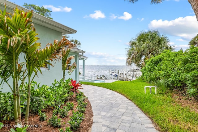 1313 Worth Ct NE, Palm Bay, FL 32905 - view of grassy yard featuring a dock, a water view, and boat lift