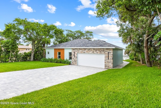 1313 Worth Ct NE, Palm Bay, FL 32905 - ranch-style home featuring an attached garage, a front lawn, decorative driveway, and stone siding