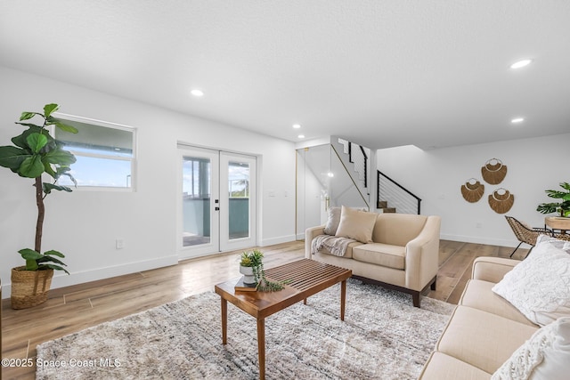 1313 Worth Ct NE, Palm Bay, FL 32905 - living area featuring wood finished floors, stairs, baseboards, and recessed lighting