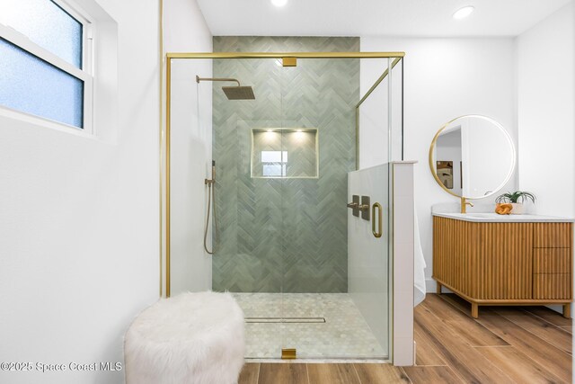 1313 Worth Ct NE, Palm Bay, FL 32905 - full bath with vanity, a stall shower, wood finished floors, and recessed lighting